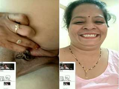 Indian mommy with hot curves plays with her shaved pussy and a gentle clit