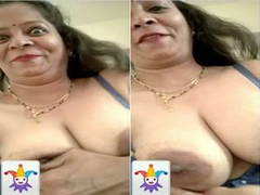 Hot desi mama is proud of her big boobs so she demonstrates it during a video call