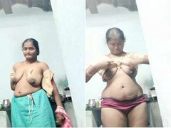 Naked Desi woman with saggy natural XXX boobs stripping down for the camera