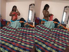 Another Desi woman that is naked as she talks on the phone before the XXX