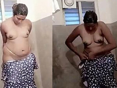 Fat sexy aunty wearing dress after nude bath XXX spy cam