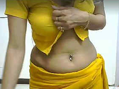 Desi babe takes off her yellow saree on camera as she is dancing like XXX